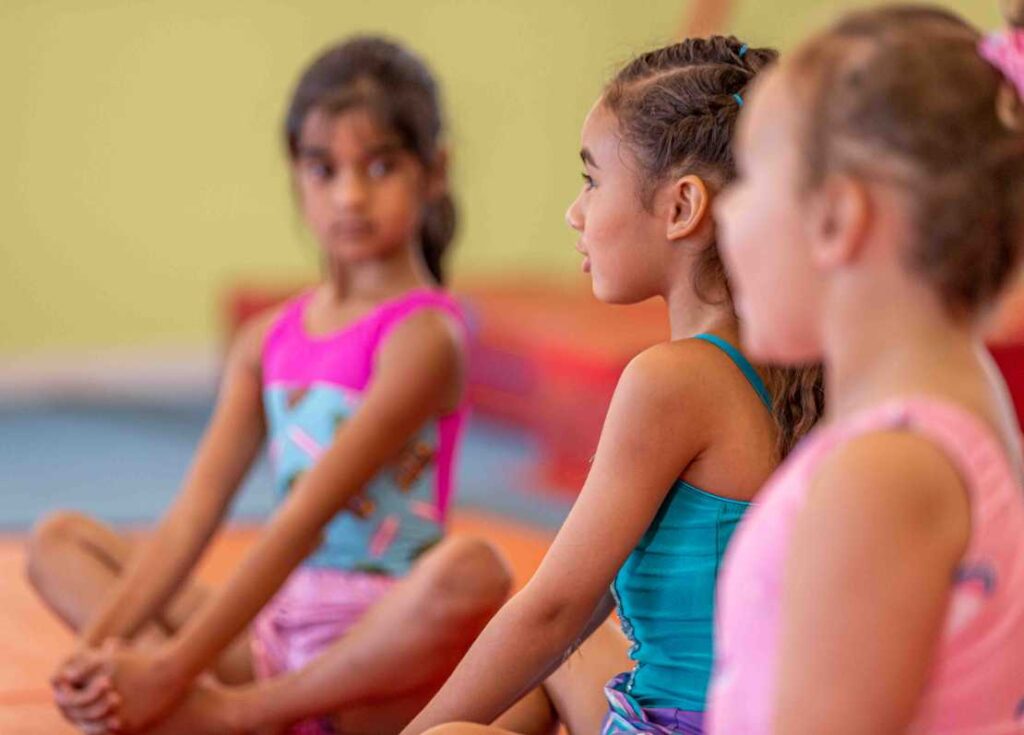 LittleGymBDay-1843 group of girls waiting to start a dance class